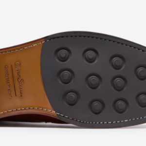 Closeup of Leather sole with cleated rubber forepart