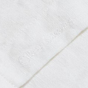 Closeup of Embroidered branding on placket