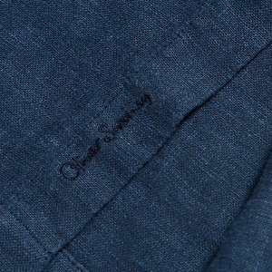 Closeup of Embroidered branding on placket