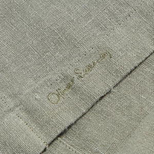 Closeup of Embroidered branding on placket